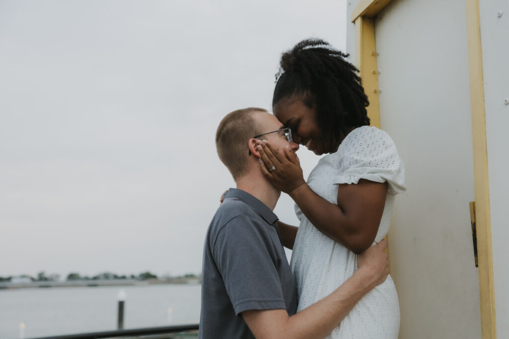 Couple at a lighthouse at The Harbor in Rockwall, Texas