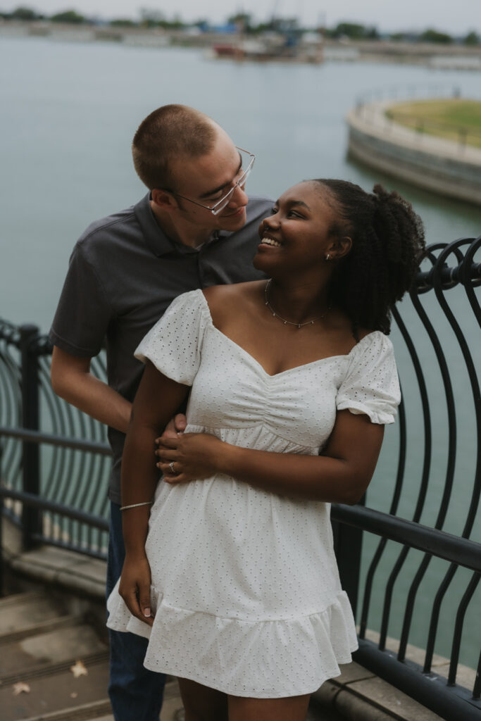 Engaged couple in front of a lake in Rockwall, Texas