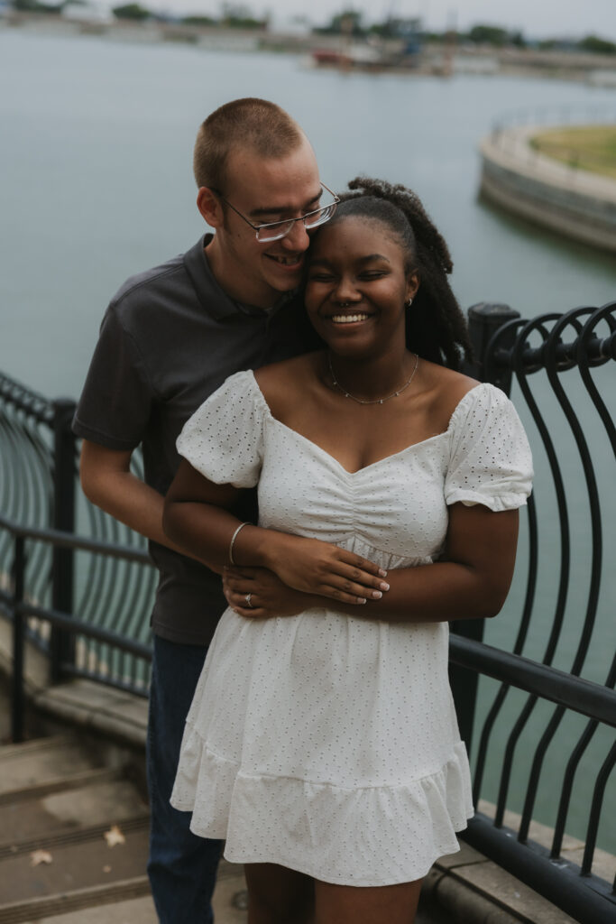 Engaged couple in front of a lake in Rockwall, Texas