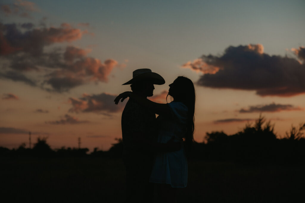 Silhouette of a couple during a field engagement photoshoot in Dallas, Texas 