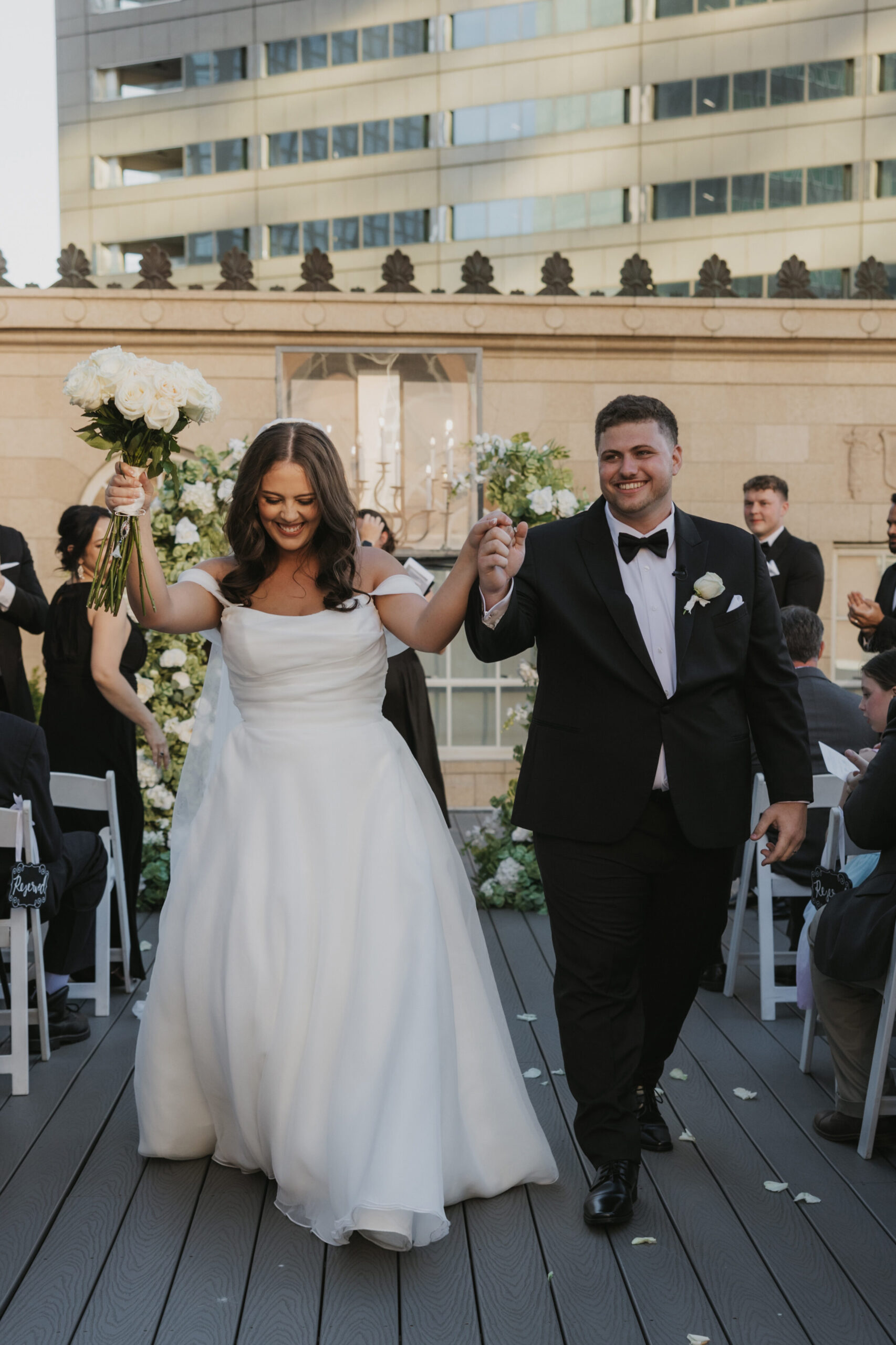 Couple during their rooftop wedding ceremony in downtown Dallas