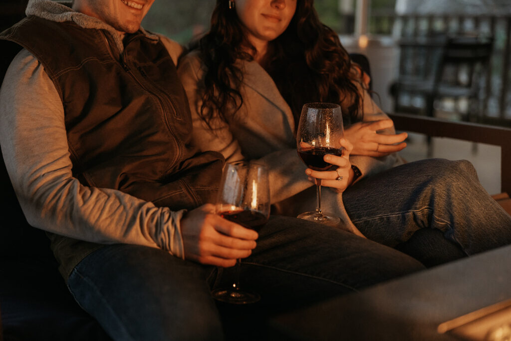 couple enjoying wine after engagement photoshoot