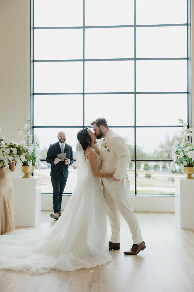 first kiss with bride and groom during the ceremony