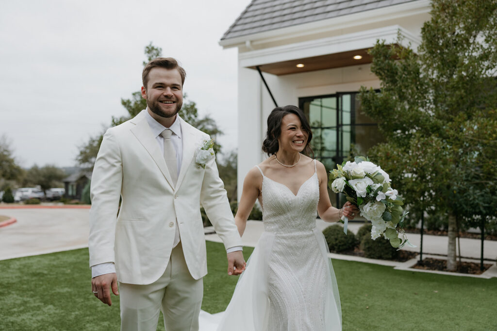 bride and groom walking and smiling