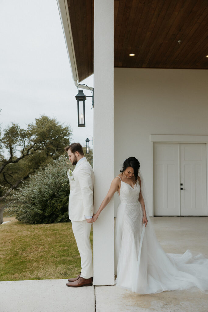bride and groom first touch and prayer