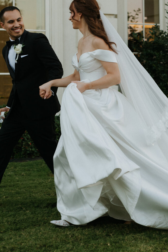 cinematic wedding photos couple running