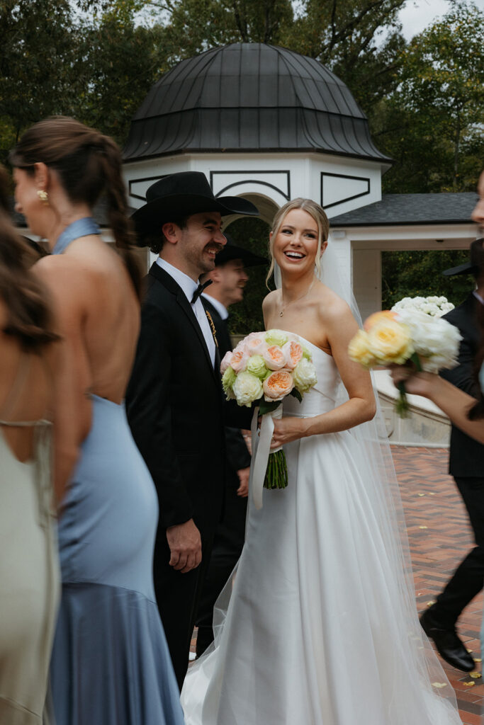 blurry bridal party photos walking around the bride and groom