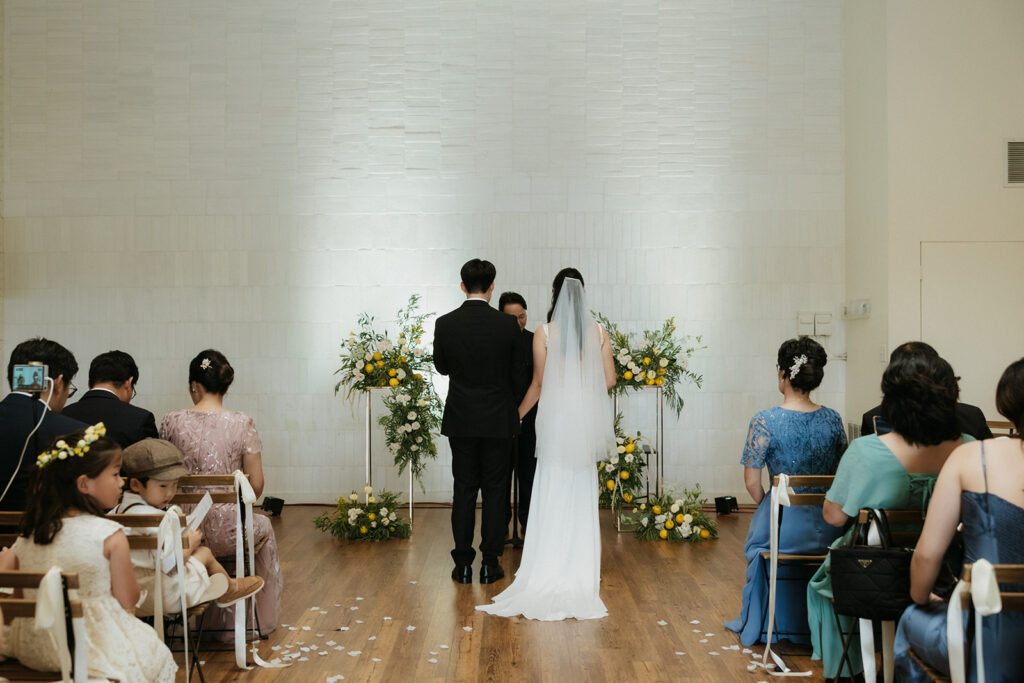 Bride and groom standing during the Christ centered wedding ceremony.