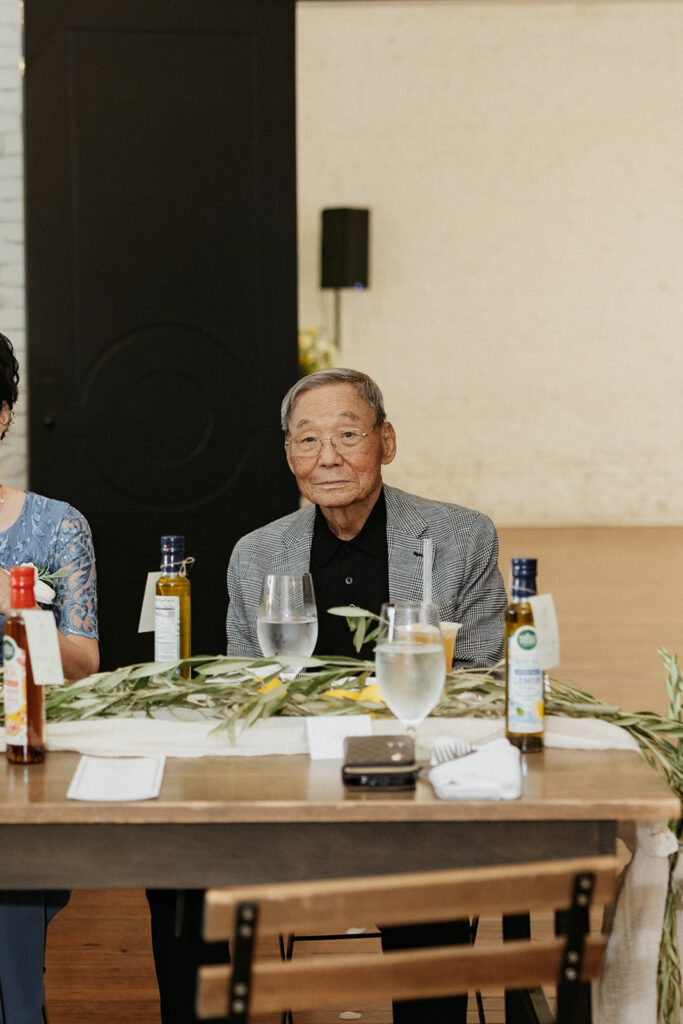 The grooms grandfather enjoying the wedding reception at One Eleven East Hutto Texas.