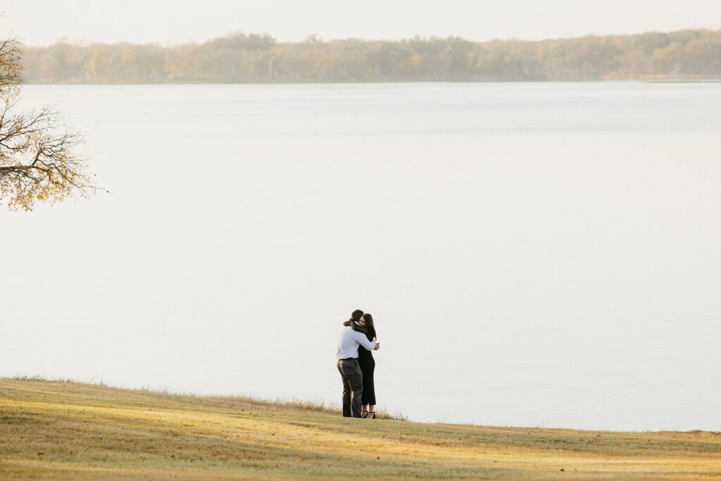 Couple hugging after getting engaged in Waco, Texas.