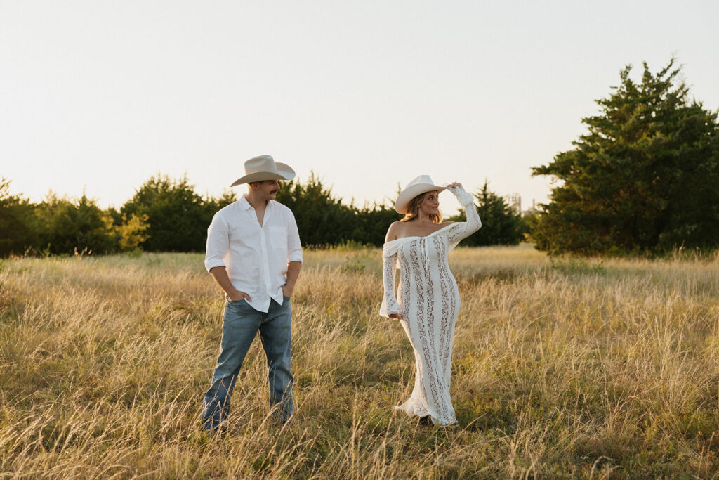 Woman looking off into the distance while her fiancé looks at her romantically.