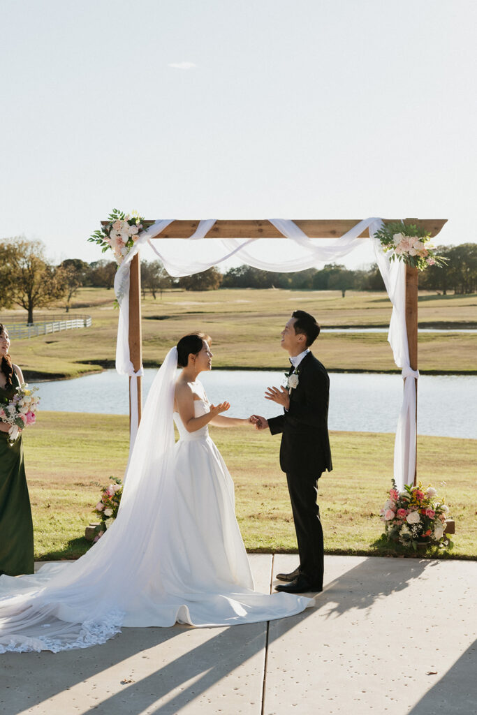Couple worshiping during their Christ-centered wedding ceremony at Bella Cavalli Events in Texas.
