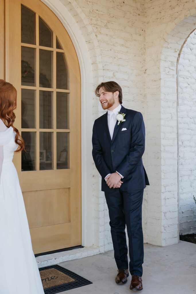 Groom seeing his bride for the first time during their first look.