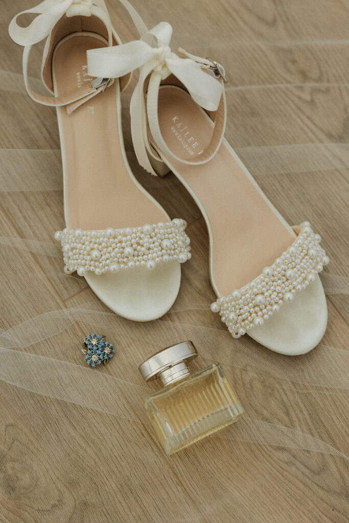 Bridal heels, perfume, and jewelry. 