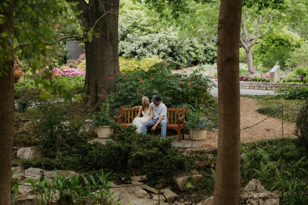A couple sitting on a bench at the Dallas Arboretum and Botanical Garden.