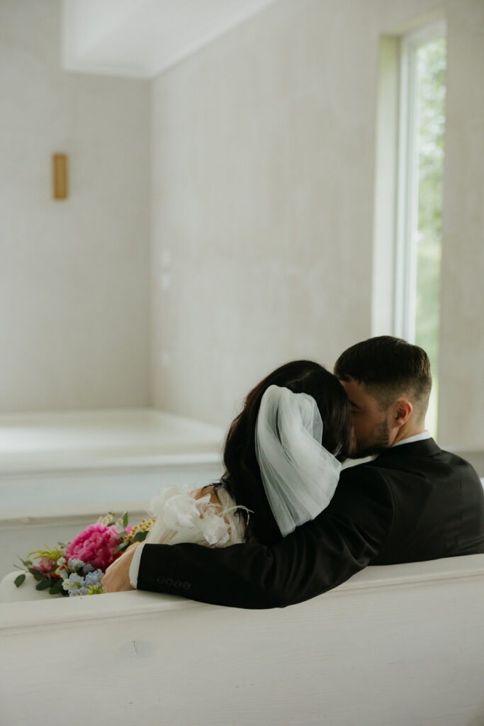 A couple leaning together at a DFW wedding venue.