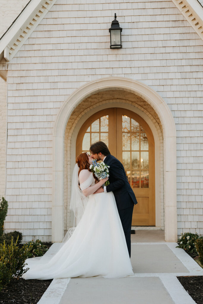 Bride and groom kissing at The Nest at Ruth Farms.