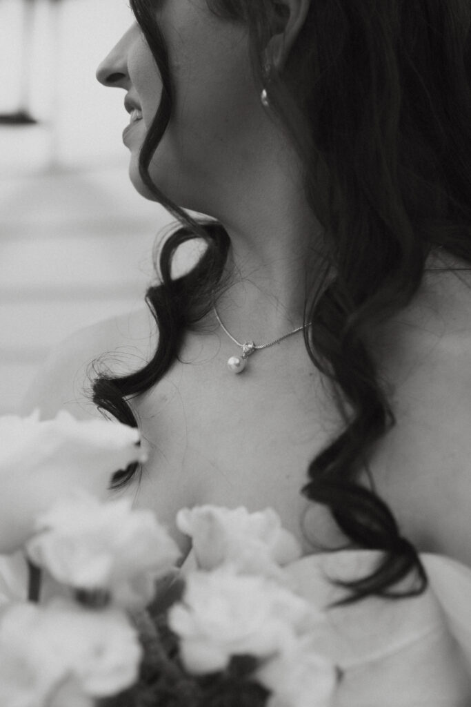 Bride wearing a pearl necklace. 