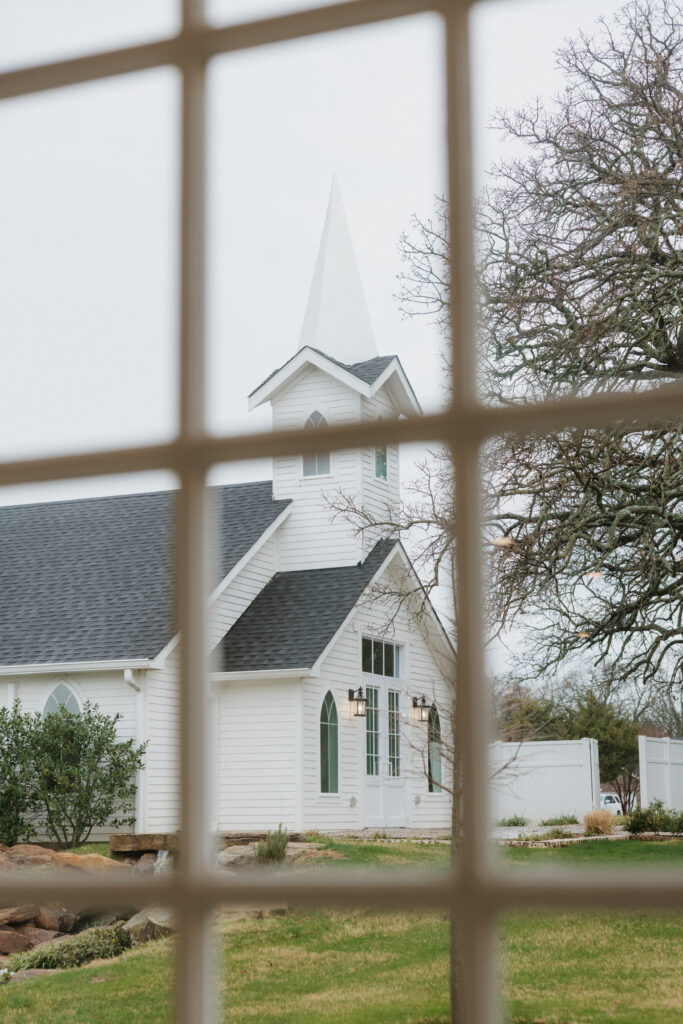 The white chapel outside of a window at The Springs Valley View Estate. 