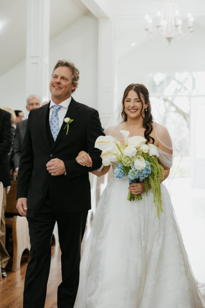 Father of the bride walking his daughter down the aisle. 