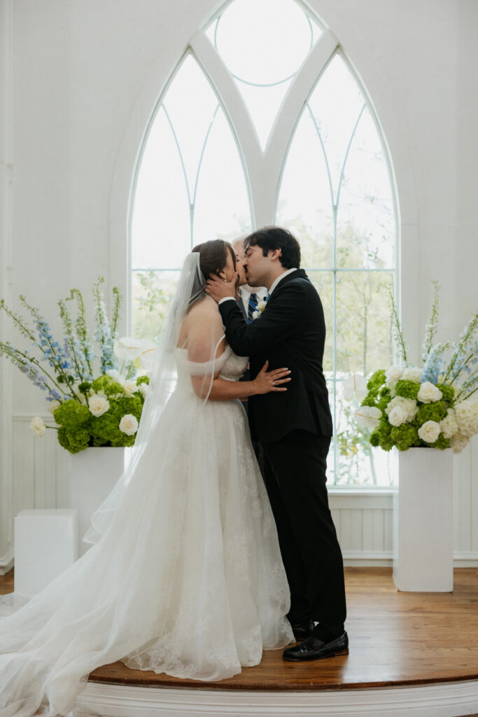 Bride and groom kissing during their ceremony at The Springs Valley View Estate.