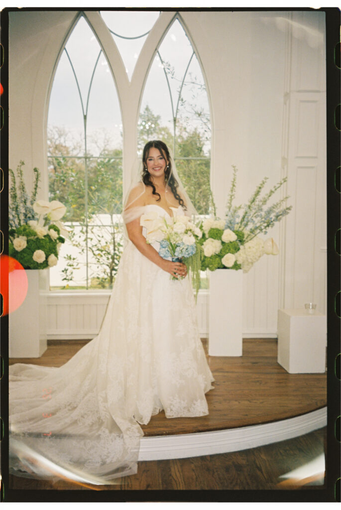 Film photography of the bride holding flowers.