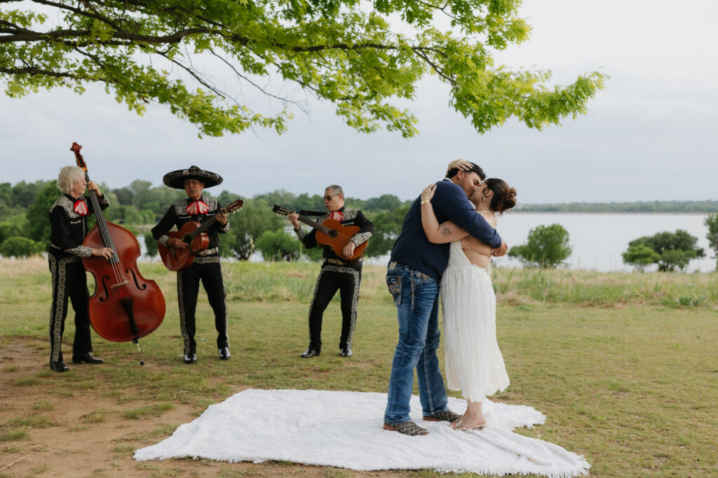 Couple kissing during their White Rock Lake Proposal at Winfrey Point.