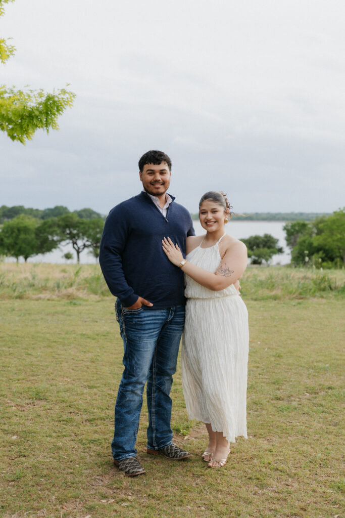 Couple smiling together during their White Rock Lake engagement photos.