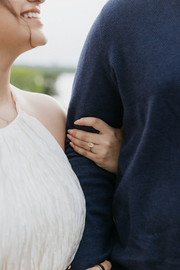 Woman holding her fiancé.