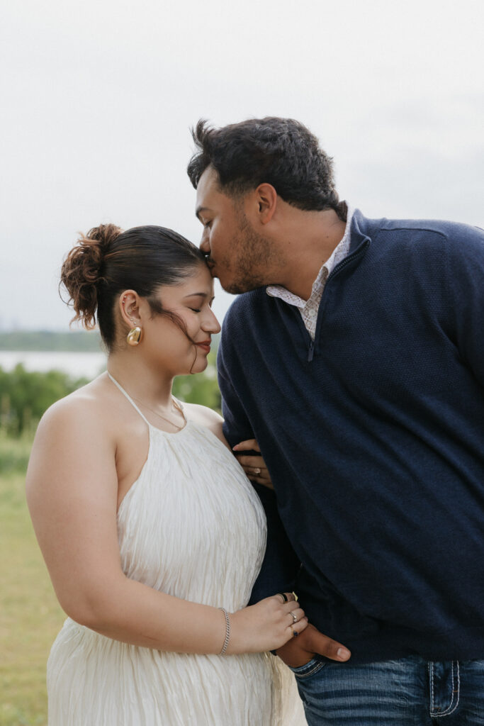 Man kissing his fiancée.