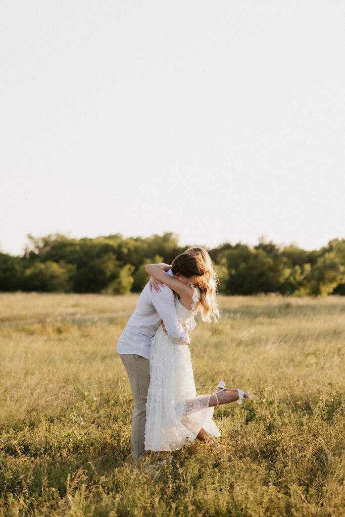 Couple hugging during their outdoor proposal in Dallas.