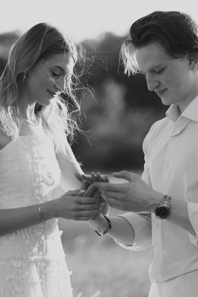 Man admiring the ring on his fiancée's finger. 