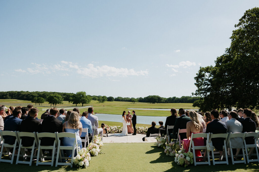 Guests seated watching the elegant wedding ceremony.