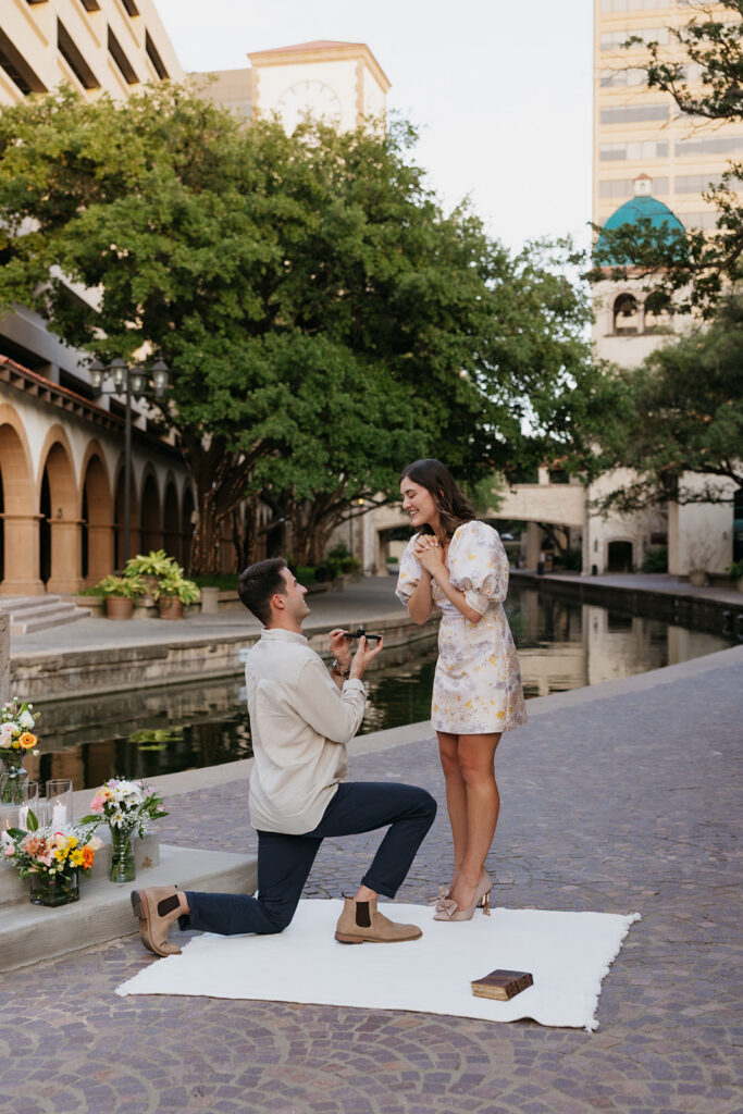 Man proposing at Mandalay Canal Walk in Las Colinas in Texas.
