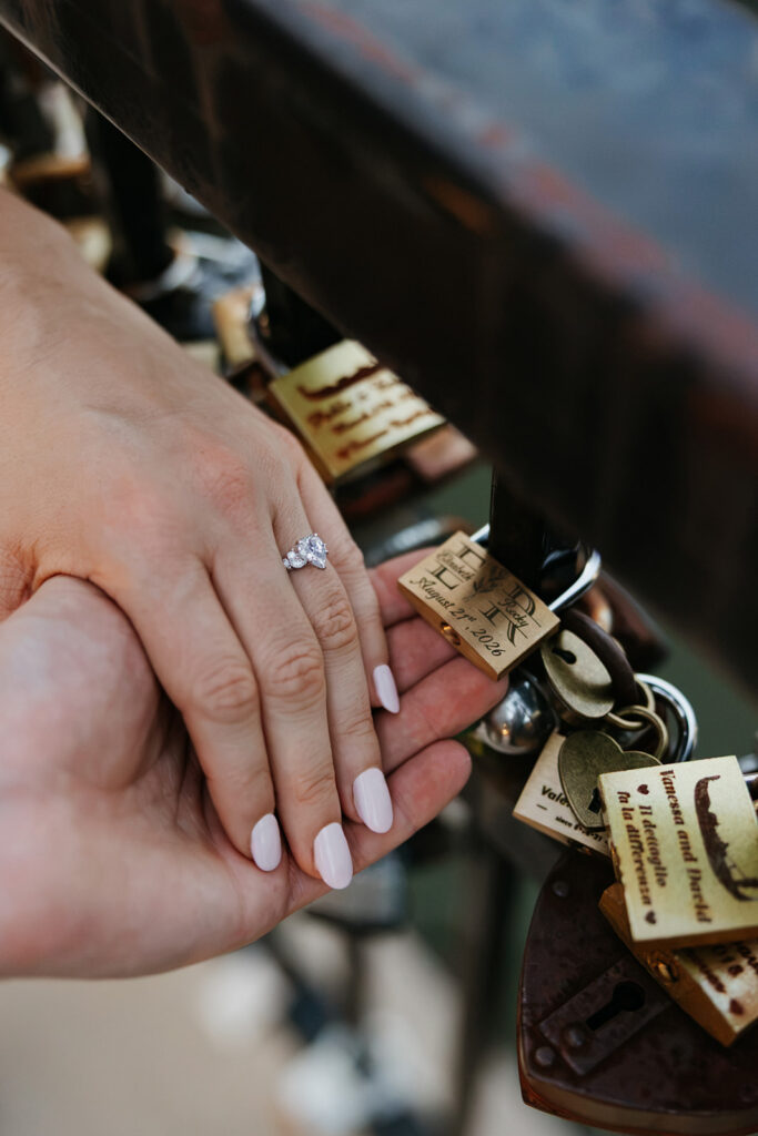Couple holding their lock on the Love Lock Bride at Las Colinas. 