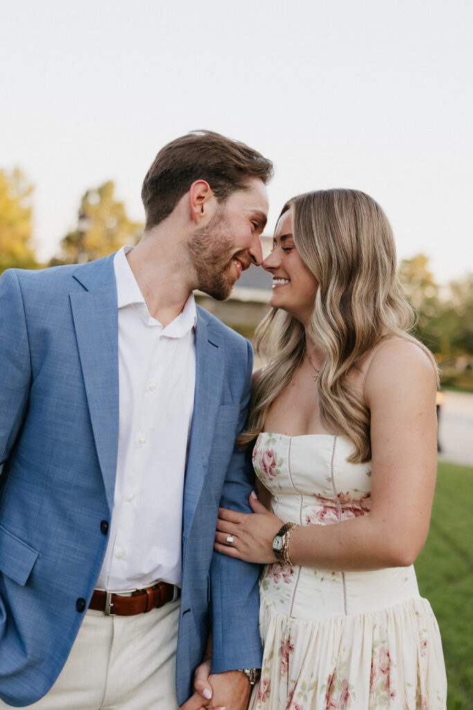 Couple about to kiss during their surprise proposal.