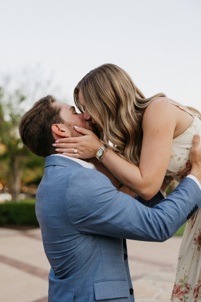 Woman kissing her Fiancé. 