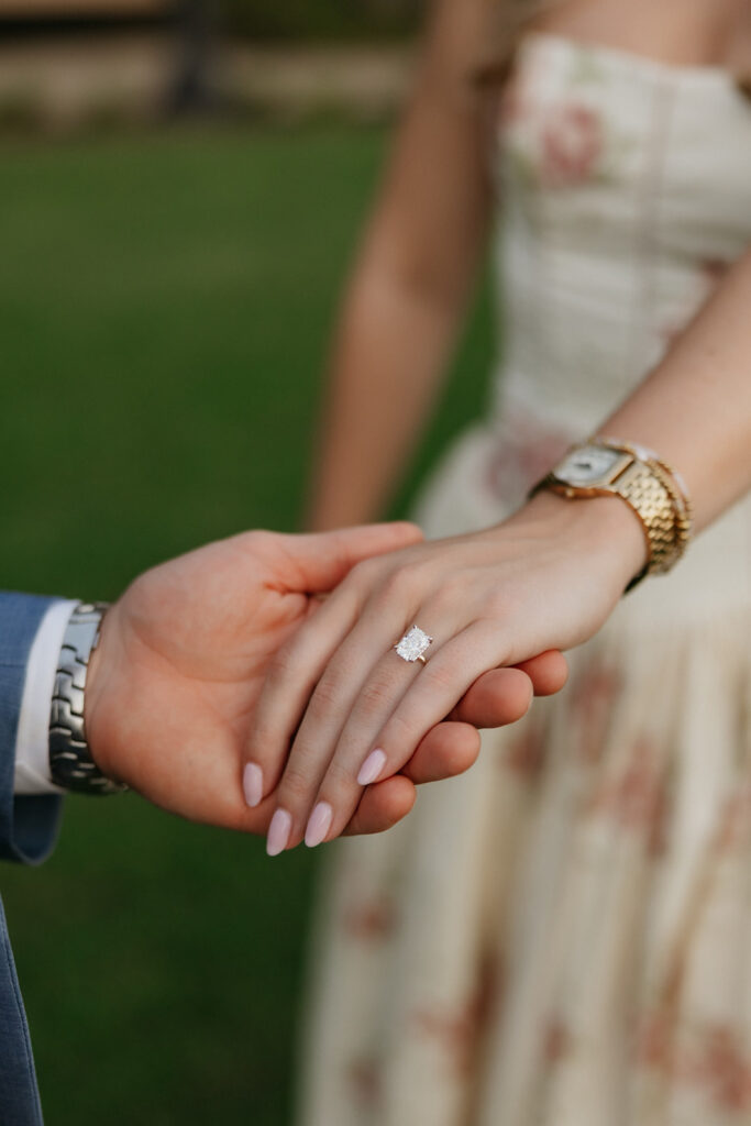 Woman wearing an engagement ring.